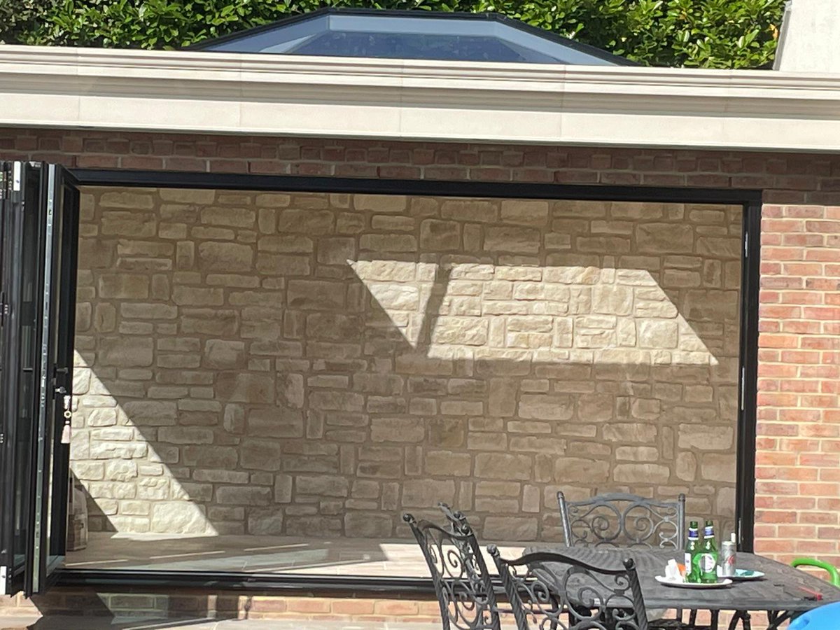 Our Have Buff precast stone slips used on an external project. higginscladding.co.uk #stonewalls #gardenfeature