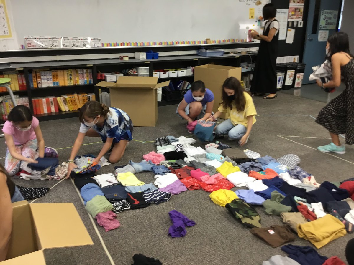 asijJessee's tweet photo. "Fuku-no-chikara" project started now!  Kids' are creating a video, posters, and boxes, checking and packing used kids clothes to send to refugee camps around the world. https://t.co/mJypUpcFSO