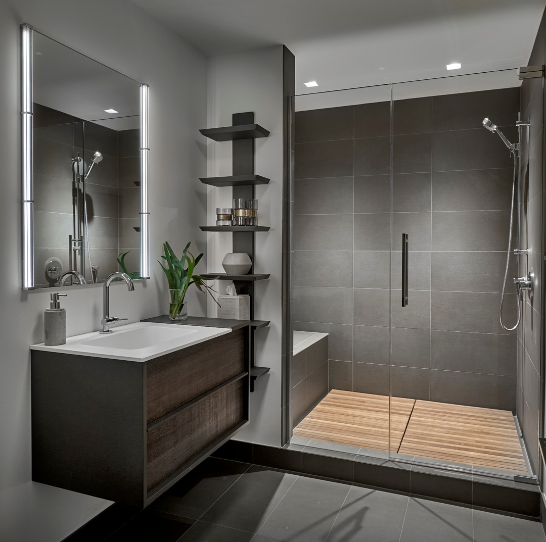 Trendy gray tile gray floor alcove shower photo in Chicago.

#bathroom #bath #bathroomdesign #vanity #chicbathrooms #bathroominterior #bathroomdecor #interiordesign #darkwoodcabinets