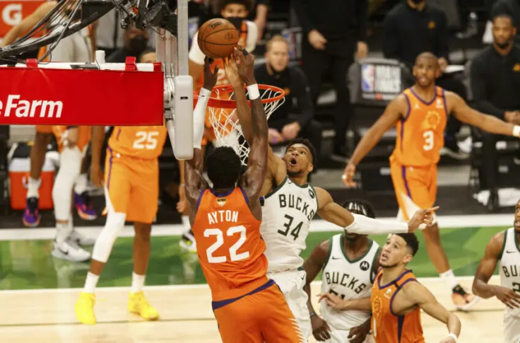 BucksFilm's tweet photo. Giannis Antetokounmpo is the only player to win Finals MVP and anchor the best defense in the playoffs in the same year since Hakeem Olajuwon.

Is he the best 2-way player in the game? https://t.co/To5PWzXnXe