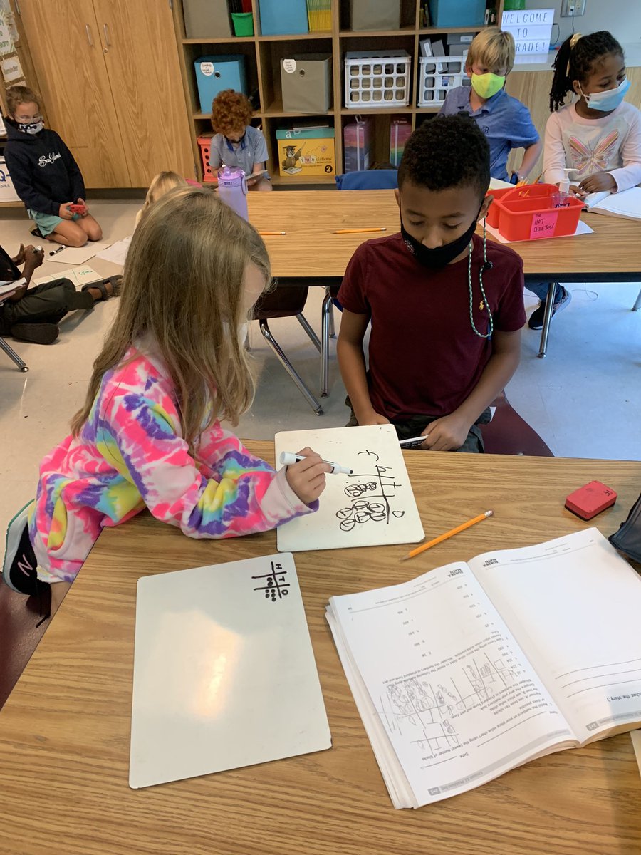 Math is more fun when you can work in partners! Students drew numbers using place value disks and then checked their work with their classmates. <a href="/jbland100/">Jay Bland</a> <a href="/SuLambCoach/">Suzanne Lamb</a> <a href="/BrandonIBPYP/">Sam DeCarlo - Morris Brandon Elementary IB PYP</a> @mbpcaps