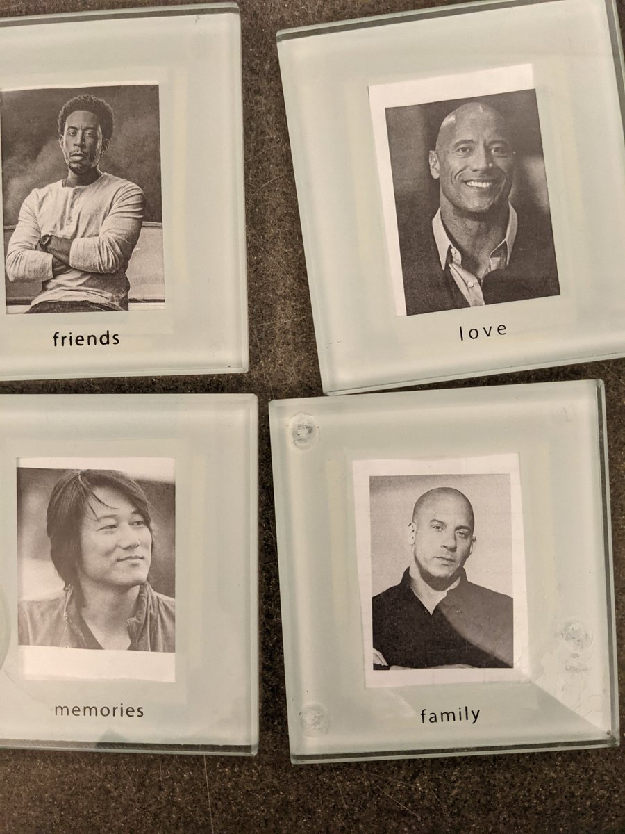 Laurterary's tweet photo. @nicolebyer @Gabrus what my coworker did with photo frame coasters. Now my cold brew sweats all over Vin Diesel's face! #fambly @NewcomersPod https://t.co/26HMq4Nvju
