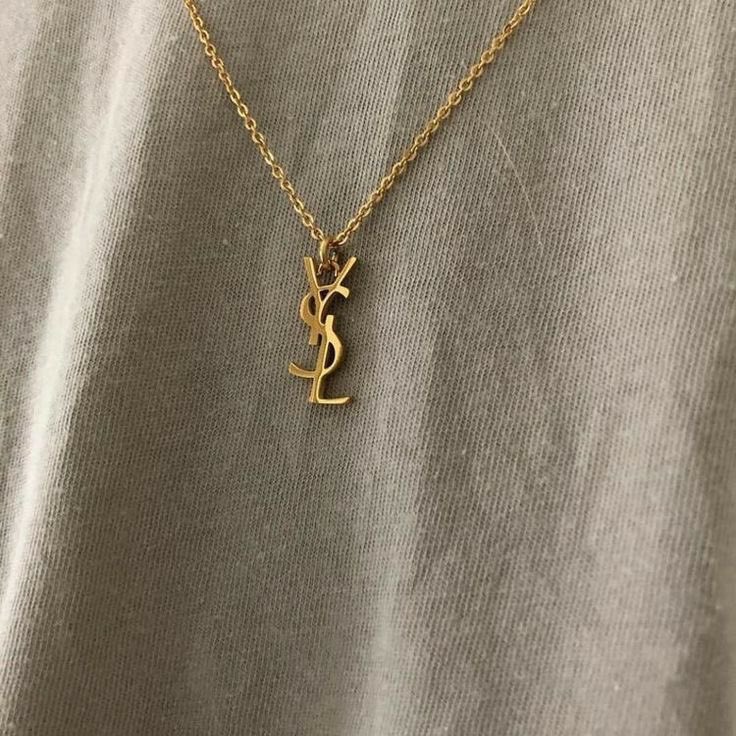 maisonartluxe's tweet photo. gold ysl necklace https://t.co/wnLwhePiTF