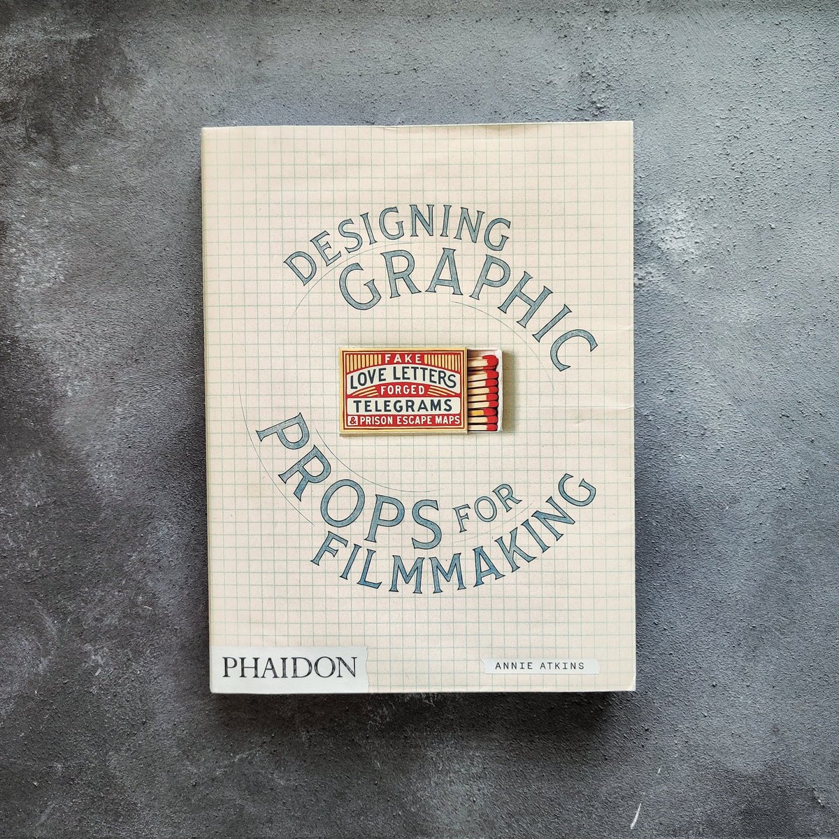 Ian_Barnard's tweet image. This is a really interesting book. It looks at what goes into the design and research of props for movies. Like signage, maps, letters and even coming up with made-up brands. I feel this would be a great career path for a lettering artist.