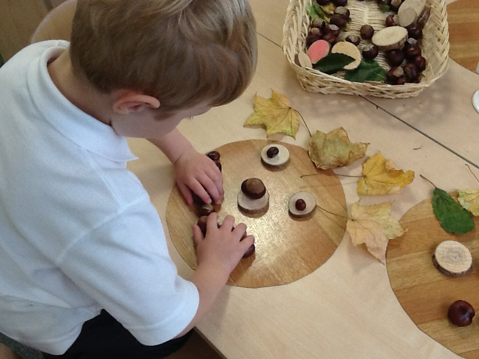 DucklingClass's tweet image. Some transient art in class this week:  making bears faces using natural materials.  We also set up a potion making water play in response to some of the children pretending to make their own potions in the role play area.
