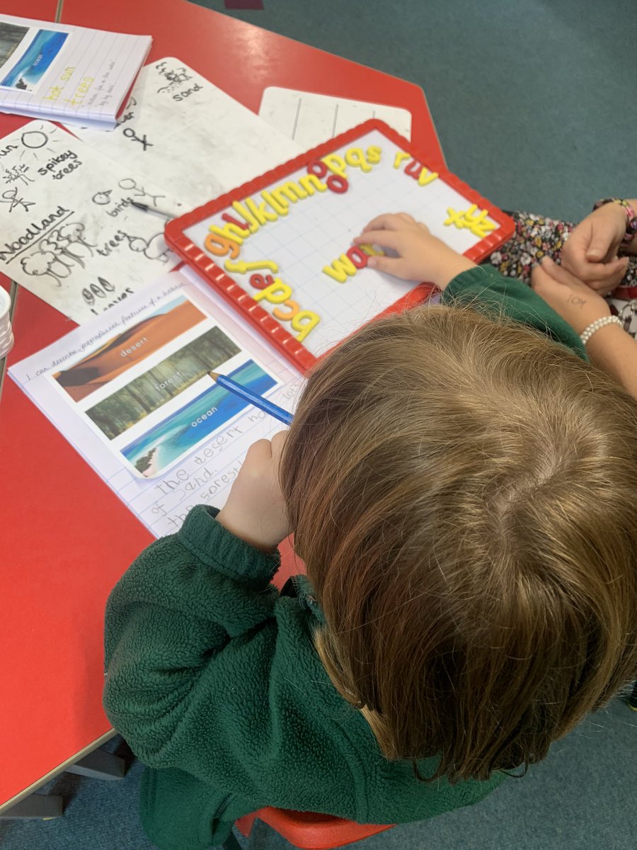 Our base pupils working on their writing skills- outstanding