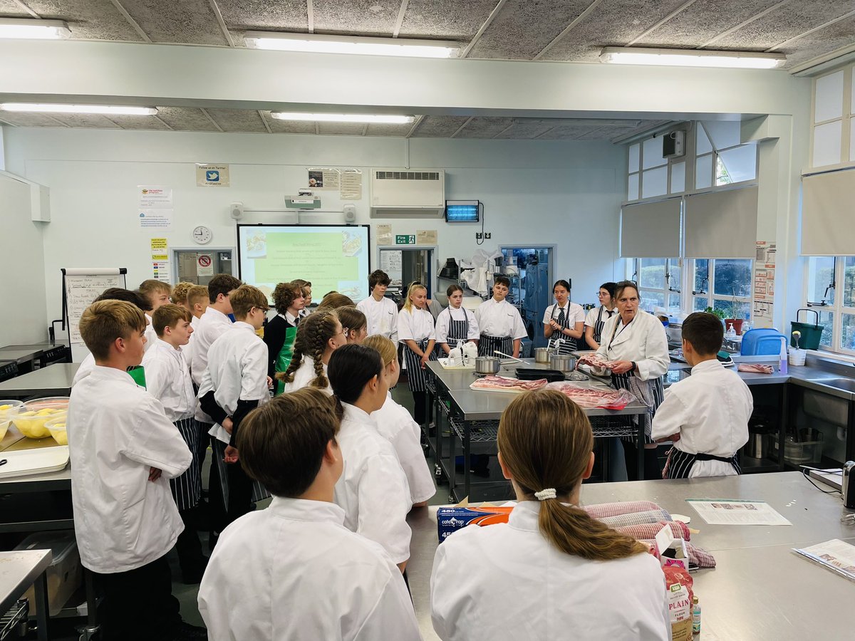 13-16 yr olds learning how to prepare and cook a pork belly?..Go on then..the utterly brilliant Mrs Elwes showing this years group some top tips on how to prepare and cook pork belly, getting it slow roasted for our 100 guest banquet tomorrow. Again 13-16 year olds! <a href="/aylshamhigh/">Aylsham High</a>