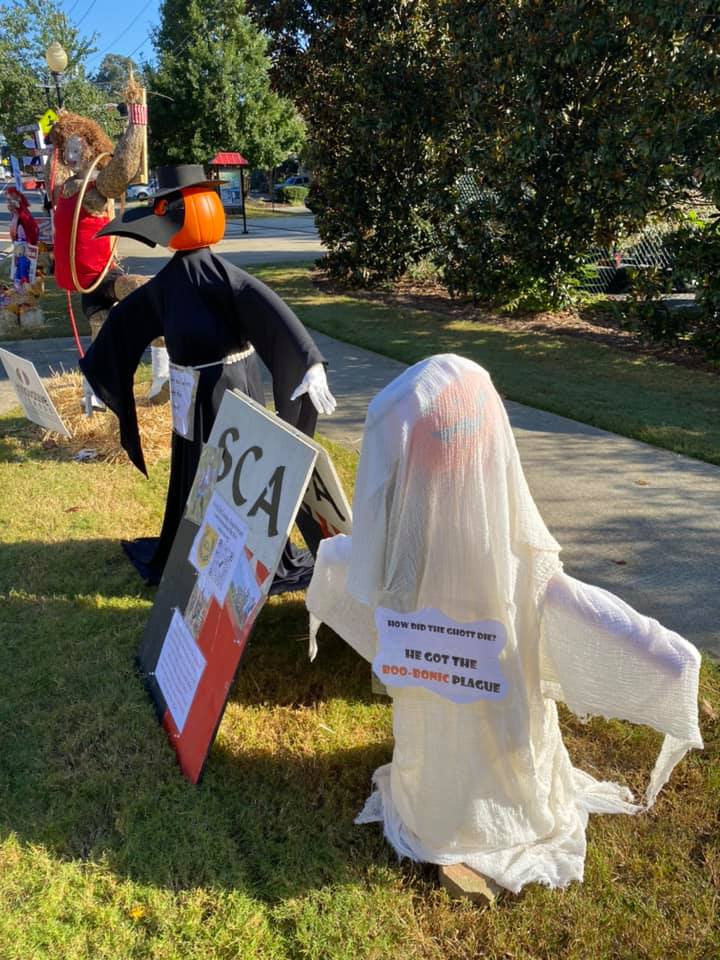 ShireOfOwlsNest's tweet photo. If you end up near downtown Kennesaw, check out the Shire’s scarecrows! These are part of the city’s Scarecrows on Main St. 
Many thanks to Adaire and Ysabel for constructing our boo-tiful scarecrows!
#mysca #ScarecrowsOnMain https://t.co/sIqO5X27Qk