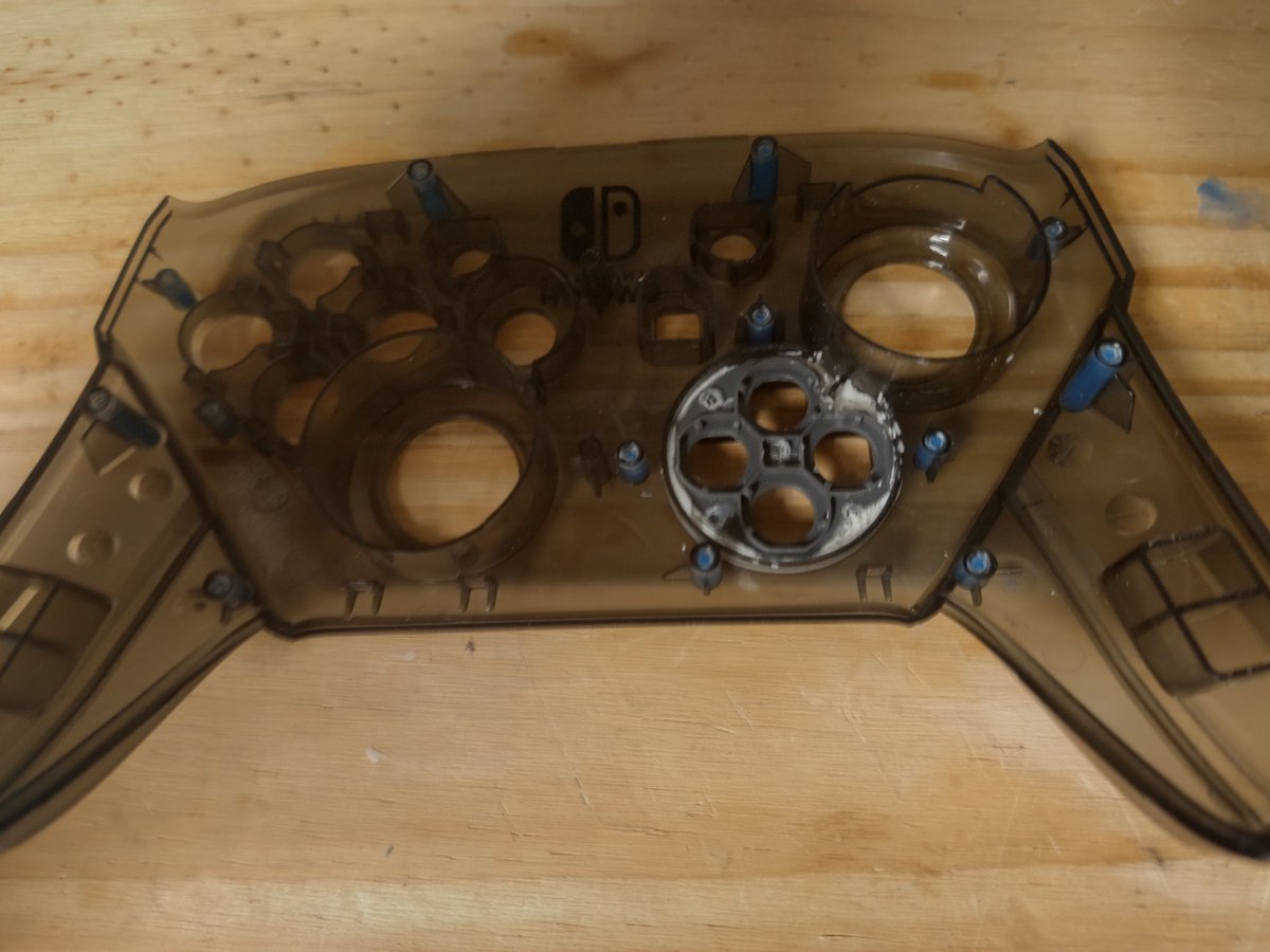 CustomsofNote's tweet photo. I realized that the button pad for the D-Pad lined up incredibly well with the joycon D-Buttons so I cut up a joycon, grinded down the D-Pad's little holding bracket, created some longer custom D-Buttons, and used modeling clay to fill in the front. https://t.co/rEmwasH0yd
