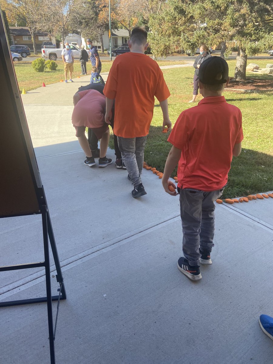 MrsMPicton's tweet image. Students placing their rocks on the path leading to ⁦@GRoadSchool⁩ ! Learning and growing along side each other. #EveryChildMatters