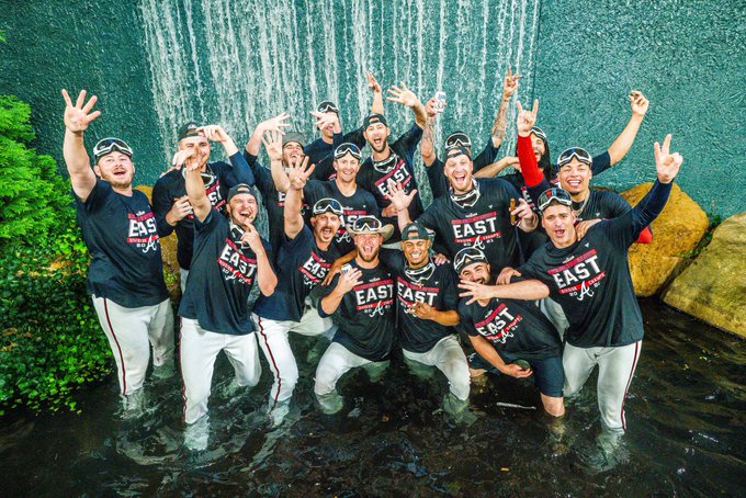 The Braves bullpen celebrates in the fountain at Truist Park.