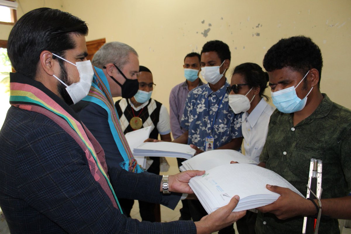 UNICEFTL's tweet photo. UNICEF Rep @Bilal_Durrani_: “Information is key to protect everyone from #COVID19: the reason we worked with @MFATNZ, @MdSTimorLeste & SECOMS on messaging in braille on #COVID19Vaccines,” as he & Amb. #NewZealand handed over flyers in braille to #TimorLeste #DisabilityAssociation https://t.co/cLnn8YbTQq