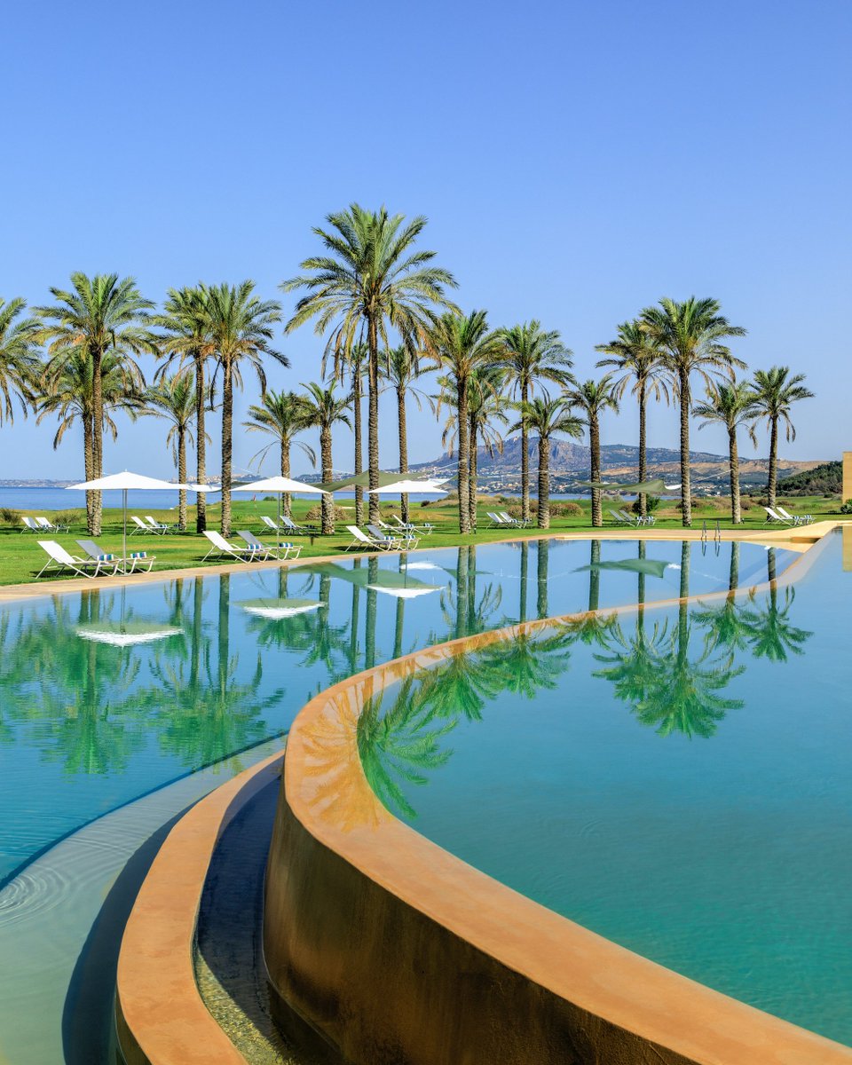 The undisturbed surface of our infinity pool is a vivid mirror that reflects the palm trees and endless blue sky above.

#RoccoForteHotels #RoccoForte  
#Sicily #VerduraResort