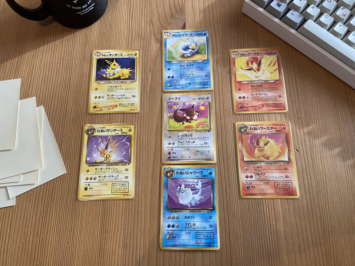 decided to reunite this little family because i felt nostalgic for these gorgeous arts

middle : eevee (jungle)
top : light jolteon, vaporeon, flareon (neo destiny)
bottom : dark jolteon, vaporeon, flareon (team rocket)