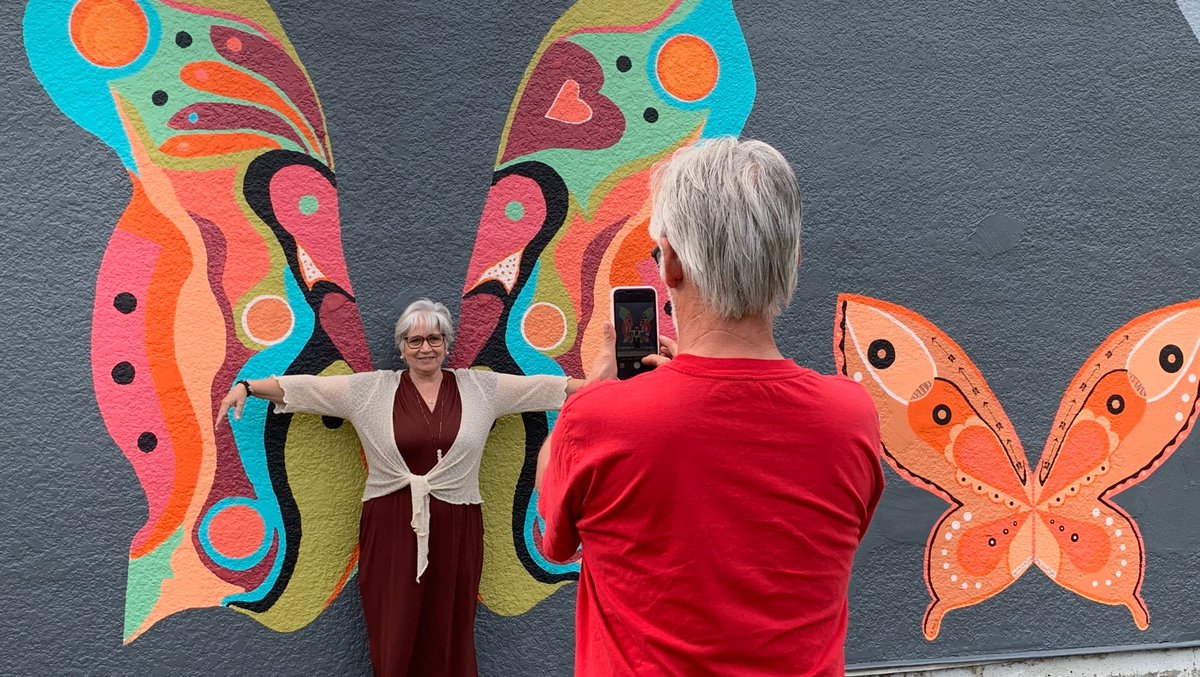 "Interactive Art - Butterfly Mural" created by artists Kathleen Kinasewich &amp; Andrea Ardiles of #SpencesBridgeBC  Be the butterfly. The beautiful orange butterfly was created to honour the lost souls of residential schools. #CanadaNice #exploreBC #goldcountryBC #EveryChildMatters