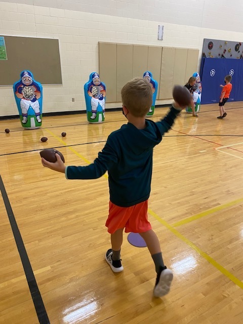 Here is Owen Bergh in Phy Ed working on overhand throwing to targets funded by PTAC!