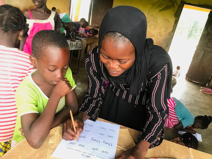 Fuseina is working on writing with a student during an after school literacy club.  So many of our students would not learn to read and write without the support of our literacy leaders, who were not so long ago struggling to learn themselves.  
#CreateChange #GirlsEducation