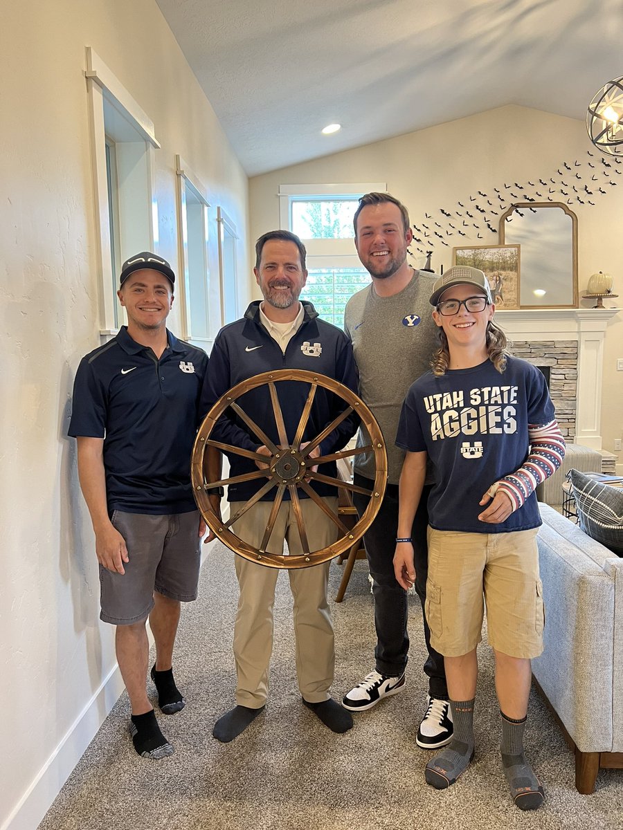tpack11's tweet photo. My son in law (who is totally rad!) @bstanng is a big #BYU fan. He married into an #Aggie family. We started our own wagon wheel tradition tonight. Come on @USUFootball Let’s get it! #beatbyu #goaggies #usuvsbyu #afamilydivided https://t.co/hZQgRoZT2c