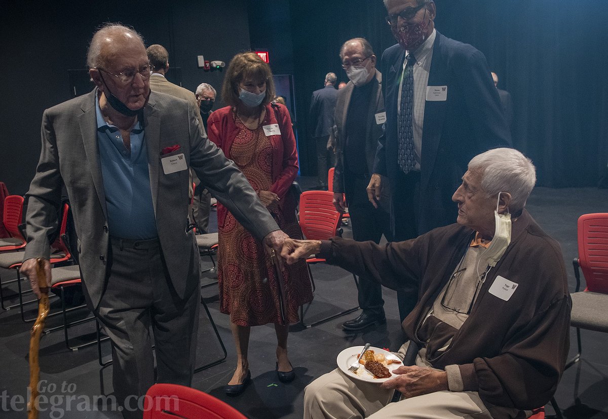 Holy Cross and Boston Celtics legends Bob Cousy, left, and Togo Palazzi, right, fist bump as Cousy arrives for an event celebrating the life of Donald 'Dee' Rowe at Worcester Academy Friday night. @WorcesterAcdmy @holy_cross @celtics @BillDoyle15 @tgsports https://t.co/N2kDVh4NmC