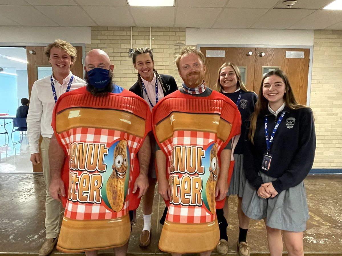 Coach Graf &amp; Mr. Hiebert were thrilled to wear peanut butter costumes at the request of the winning houses of this year’s PB drive.KMC donated 9,511 jars to Our Daily Bread Food Pantry. The houses donating the most were Catherine of Siena and Francis Xavier. Way to go, Crusaders!