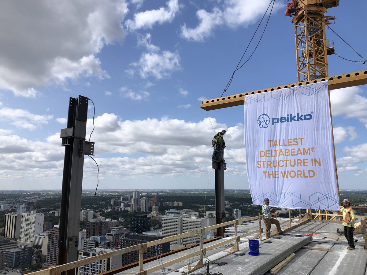 MarwestGroup's tweet photo. Throwing back to a prior milestone 6 weeks ago...@PeikkoCanada installs the final, and only golden Delta Beam at 300 Main! Officially the tallest Delta Beam based structure in the world! #winnipegstallest #worldstallest #winnipeg #winnipegconstruction #deltabeam #marwest #peikko https://t.co/jzPYjv7E9m