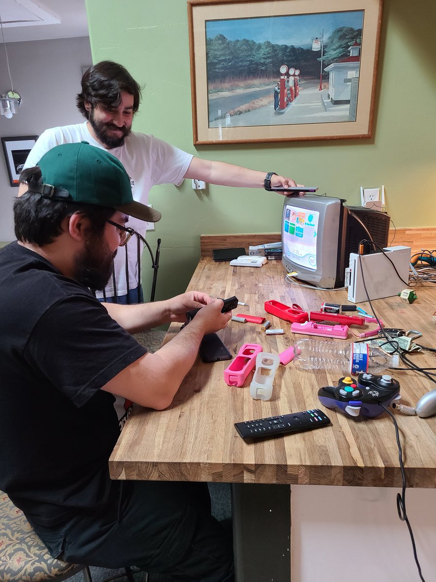 piinkhat's tweet photo. We walked to a pawn shop because we didn't have a wiimote. We bought an ENTIRE wii from a pawnshop because they wouldn't sell us the remotes individually. Then we had to search the entire area for batteries and we were desperately trying to get ANY power from these old batteries https://t.co/OvlPowgjKX