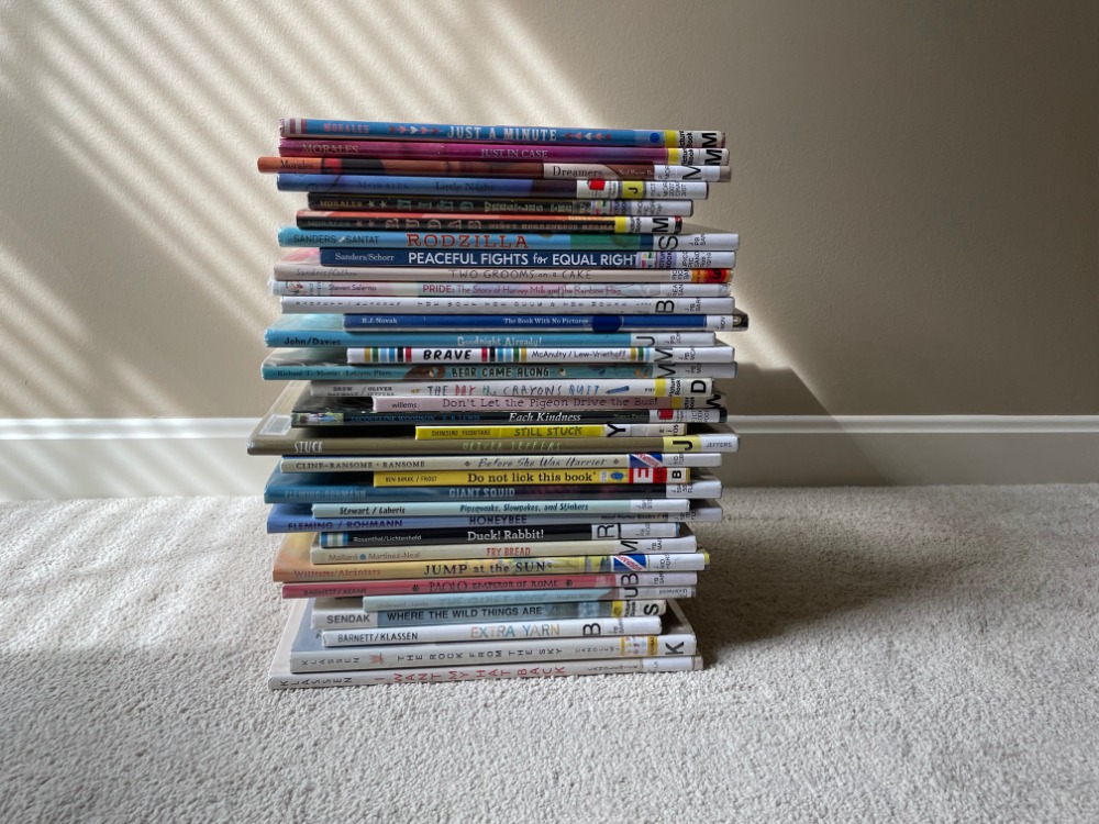 jenhelwig's tweet photo. Spent yesterday evening with this stack of wonderful picture books from the #PBSummit 2021 recommended reading list. So relaxing and fun. I'll have to make a date with books more often! https://t.co/D3CpzOPBXk
