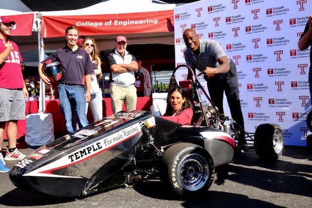 TempleUniv's tweet photo. President @JasonWingard and @gingiw taking the @TU_Engineering race car for a spin 💨 https://t.co/NP95Z4ffQ9