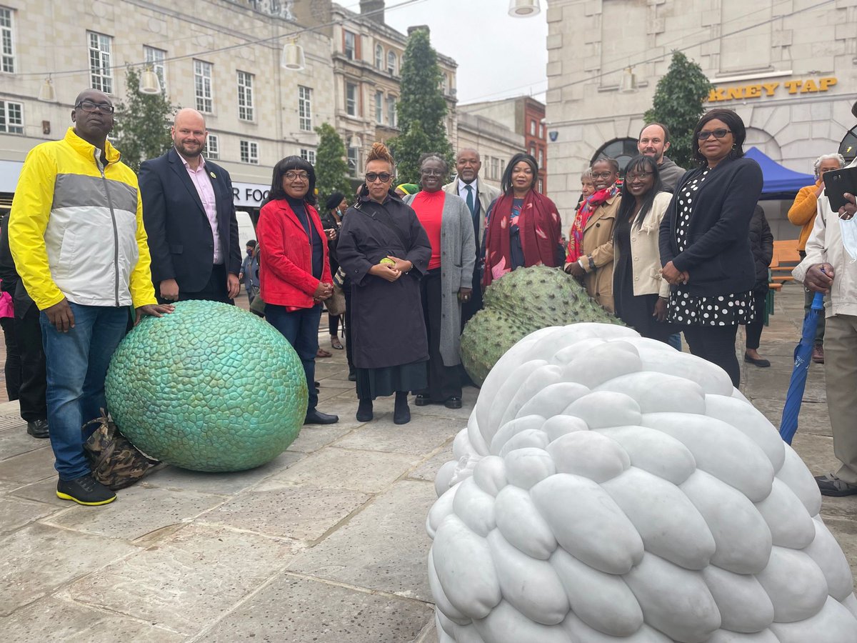 HackneyAbbott's tweet photo. Pleased to attend the unveiling in Hackney of these beautiful Windrush sculptures. They depict Caribbean fruit: soursop, breadfruit &amp; custard apple. And honour the contribution of the Windrush generation to the UK #BlackHistoryMonth https://t.co/nUgvpmyz5v