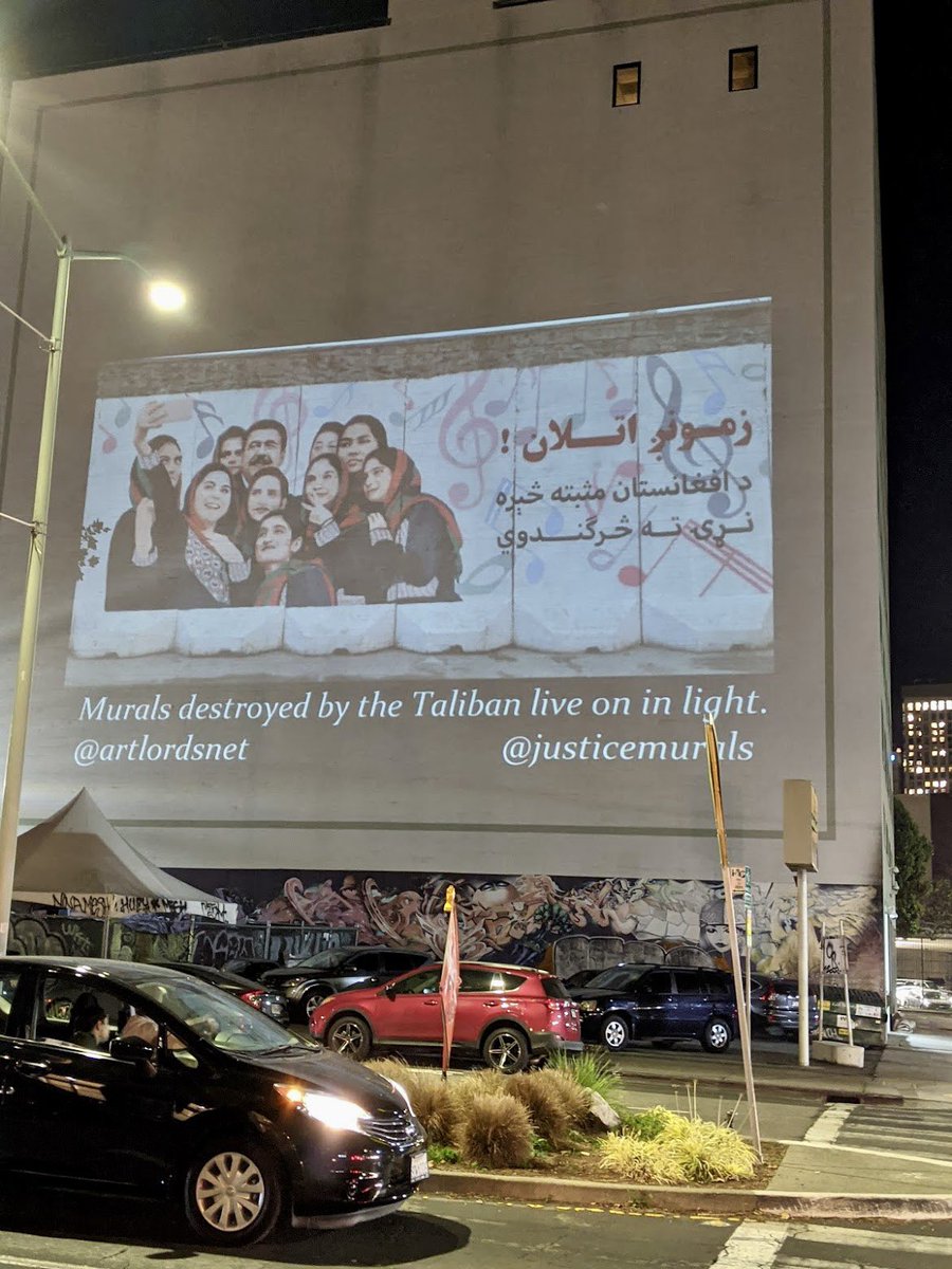 OmaidSharifi's tweet photo. Destroyed by the #Taliban and restored by light. 
@ArtLordsNet murals were projected for 90 minutes in #Oakland CA. Thanks to our friends at Justice Murals and @AEMarling. 
Reminder: Taliban have banned any expression of art and Afghan women. 18M Afghans are hungry and need food. https://t.co/luDFEnCogY