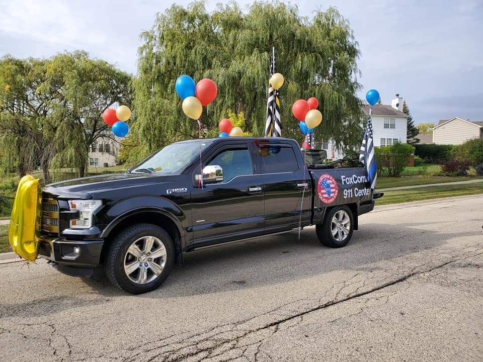 Humanize911's tweet image. We always see firetrucks and squad cars in parades. One of our local agencies decided it was time for 9-1-1 to have their own spot in it. They did an awesome job! Way to represent, Foxcomm!! #911 #Foxcomm