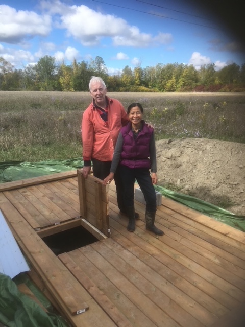 deeprootsfh's tweet photo. More hard work from our #volunteers! We're always looking for environmentally-conscious ways to grow food. Some of our Board members and volunteers dug a water cistern on our root cellar property, and built a deck to cover it. 1/2 https://t.co/v8g4XeDeue