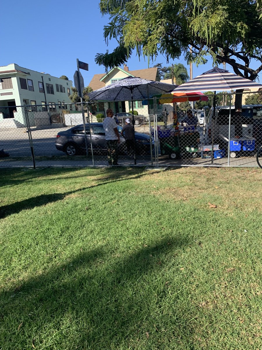 shaylarmyers's tweet photo. Echo Park, six months after the eviction, in two pictures:  ice cream boutique inside the park, respados and paletas outside the fence. https://t.co/MznqMnlhcJ
