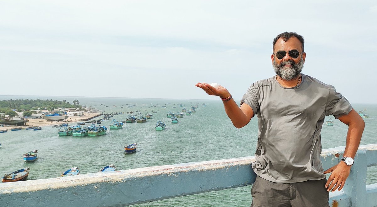 writetake's tweet photo. At historic #PambanPalam in Rameswaram enroute to Madurai Airport. I am holding a priceless pebble given by #GuruKalam's 🇮🇳 family from his Memorial in Rameswaram. I'm pumped up after this visit &amp; will now guide #YoungIndians chart right flight-path &amp; help propel their dreams. https://t.co/pH4LXRwxbr