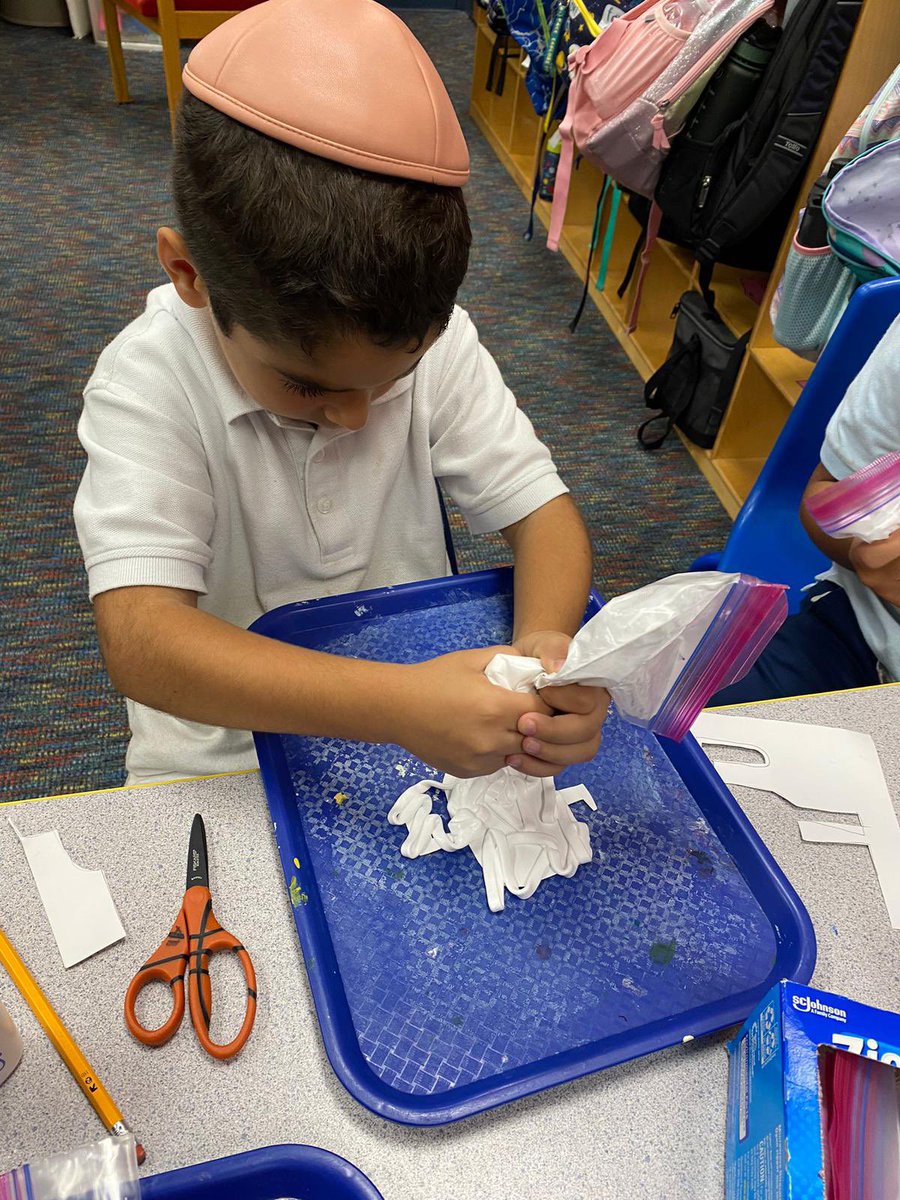 TorahDaySchool's tweet photo. First graders learned about the story elements of setting and characters by engaging in a fun art project based on the book “Beekle”. They colored a background, drew and cut out an outline of the main character, then mixed shaving cream and glue to add on top https://t.co/7YuPj1x6fN