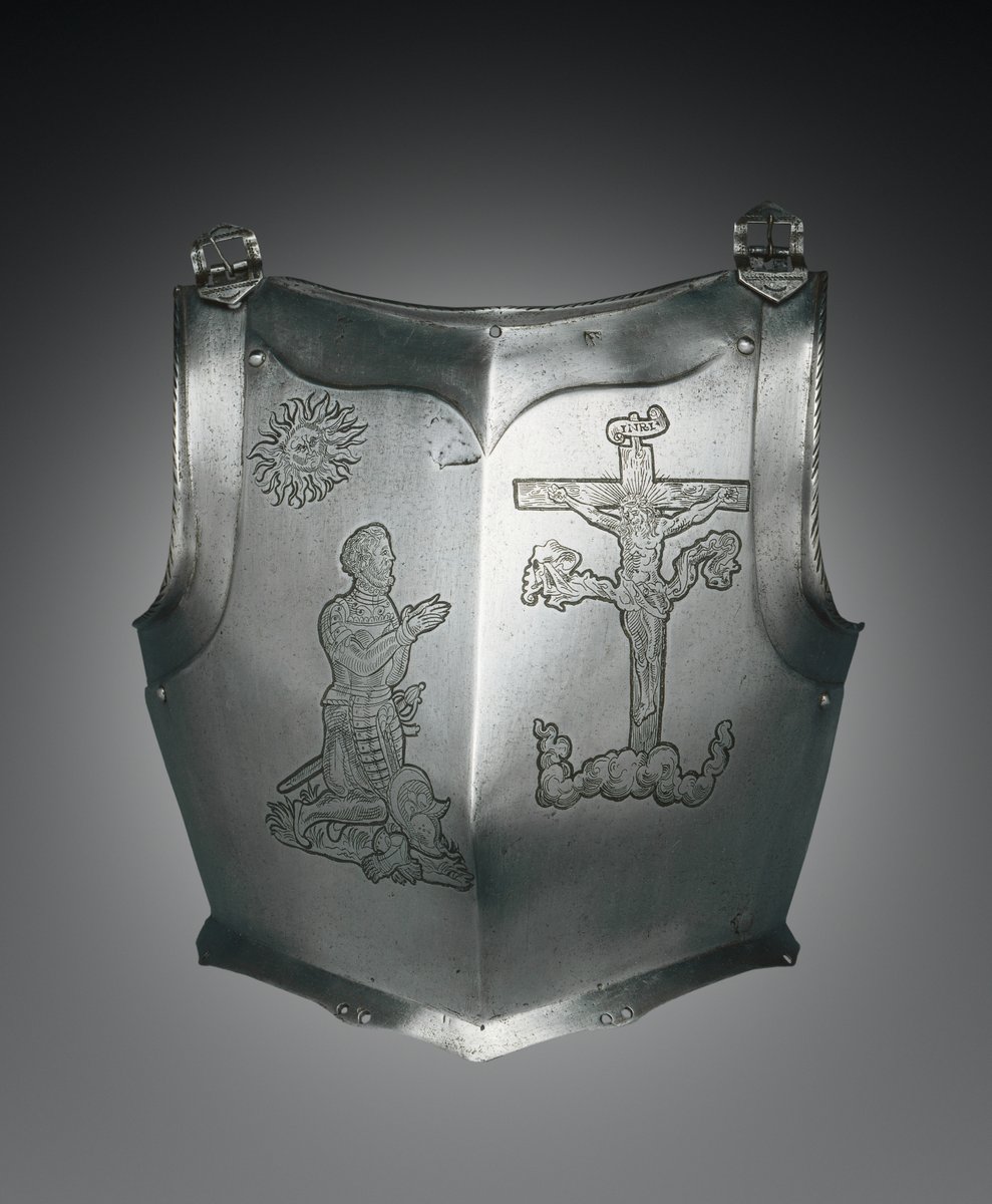 16th century German breastplate with engravings of a knight kneeling before the Crucifixion.