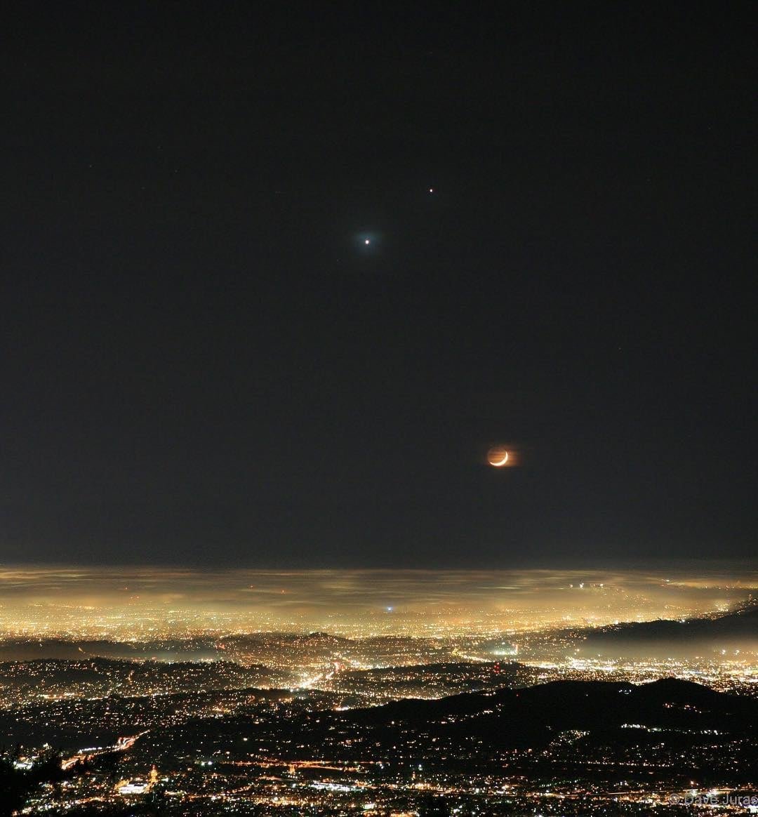 Moon, Venus and Jupiter (seen here 890 million km apart) over Los Angeles