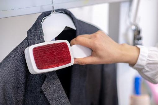 Brushing your suit jacket and trousers after each wear is important because it removes the dirt and debris that has accumulated on the outer layers before they have the chance to settle into the fabric.  It takes 30 seconds and a clean brush with stiff bristles. #clothingcare