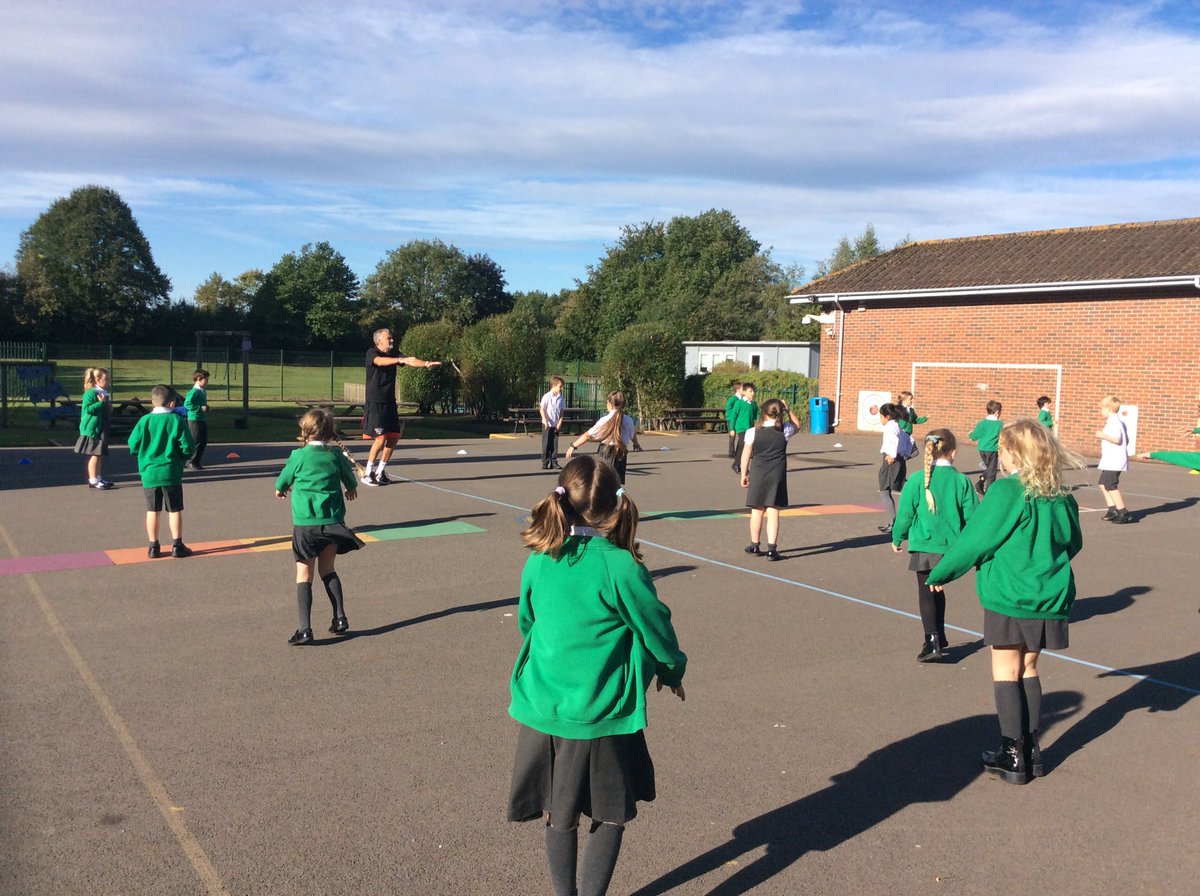 Children having fun with their favourite fitness coach Sparky