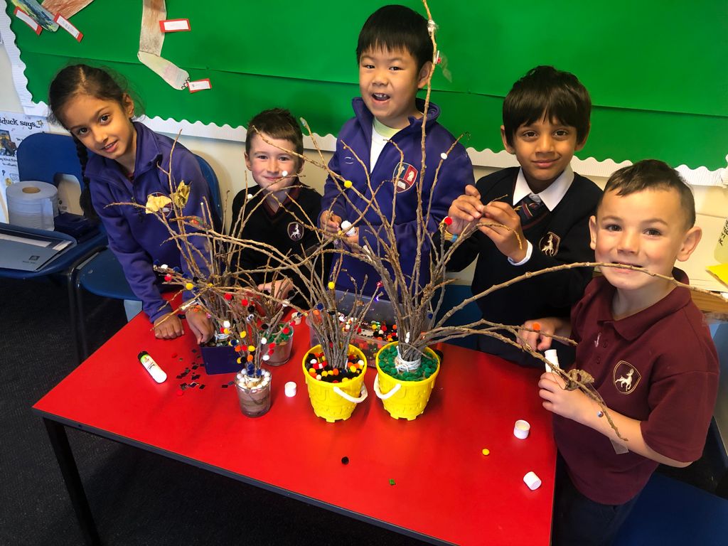 As part of our whole school 'Be a Tree' project, Year 2 were inspired to collect fallen twigs from the trees near our field.  They had created small tree-like bundles and the children realised that they were creating a small forest - just like in the book.