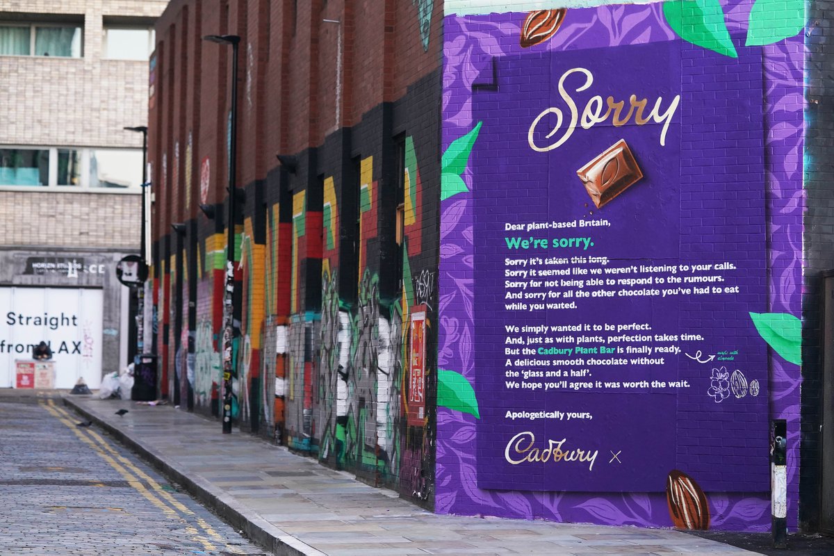 veganuary's tweet photo. Spotted in Shoreditch! @CadburyUK has an apology for plant-based Brits! 😂 Do you forgive them? 👇 #CadburyPlantBar #Veganuary #VeganNews https://t.co/VPWxMU5dbK
