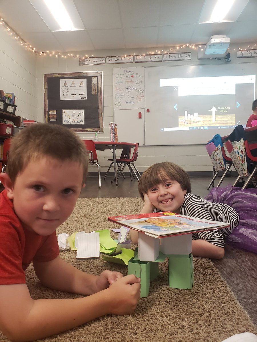 Success! Can you build a tower out of paper that's at least 6 inches tall and will hold up a hardcover book?