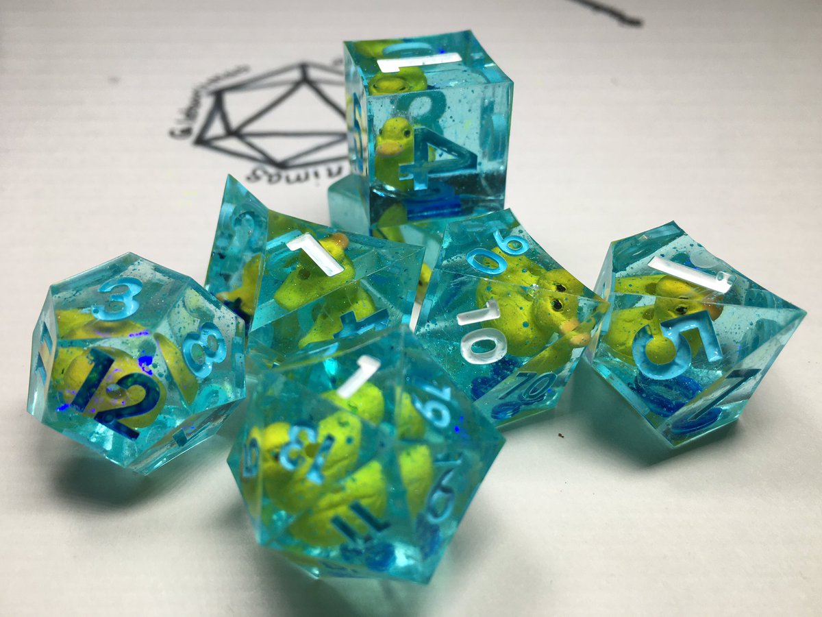 LetoAnimas's tweet photo. Here’s just a few of the latest sets I’ve been making. I’ve been finding neat things to go in dice and been going a bit wild 😆 #dice #handmadedice #resin #dnd https://t.co/sPHMjbeNbZ