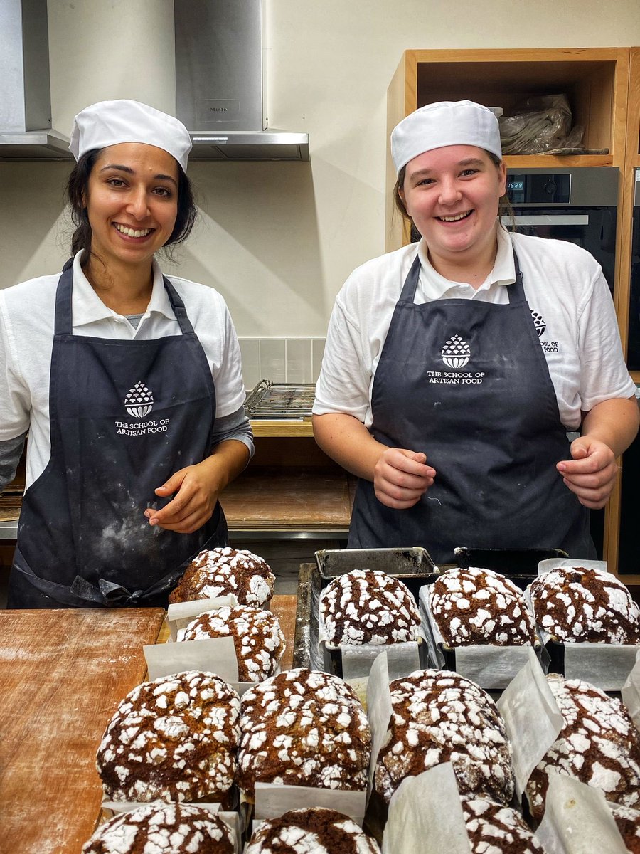 artisanschool's tweet image. Steph breaking open a festive loaf: Romana and Hannah de-tinning loaves. #happybakers