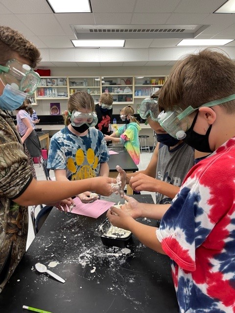 MWCSDTweets's tweet image. Mrs. Fritzs' 6th grade science classes were doing an Oobleck lab yesterday during their chemistry unit. They observed phase changes from a liquid to a solid, and a solid to a liquid, by applying pressure to a substance and changing the viscosity of the substance.