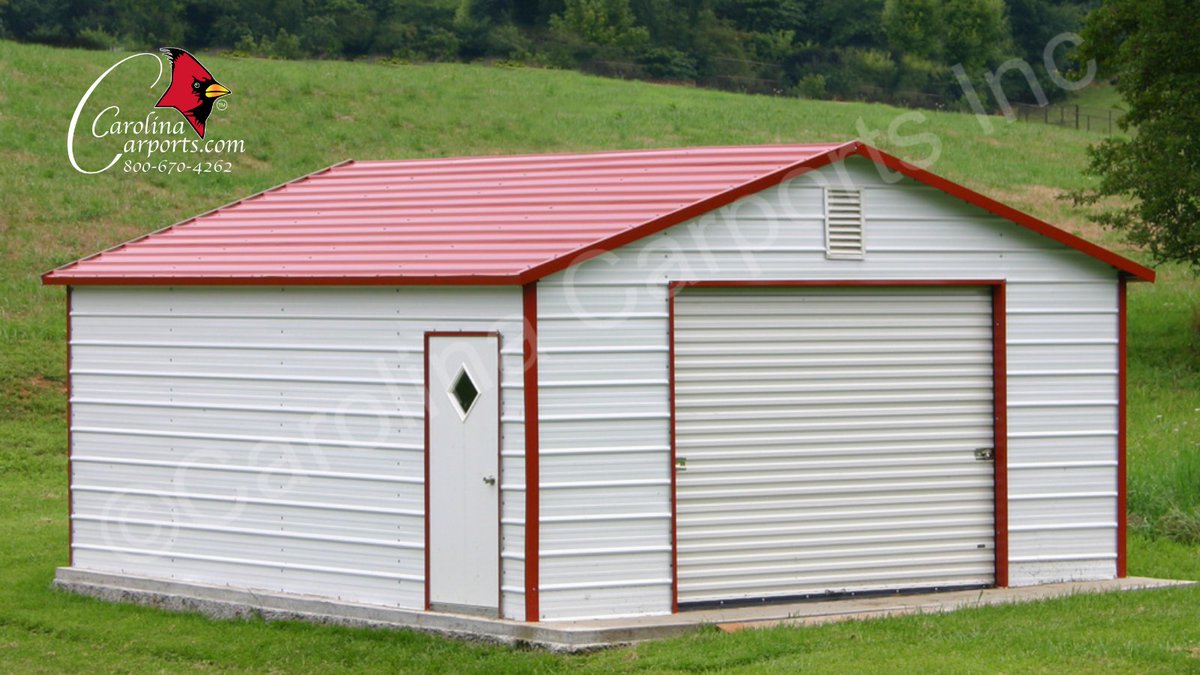 This boxed eave roof style garage that's fully enclosed with a garage door and walk-in door is the answer to your storage solutions. #garage #garagelife #garages #metalgarage #metalgarages #steelgarage #steelgarages #metal #steel #cci #carolinacarports