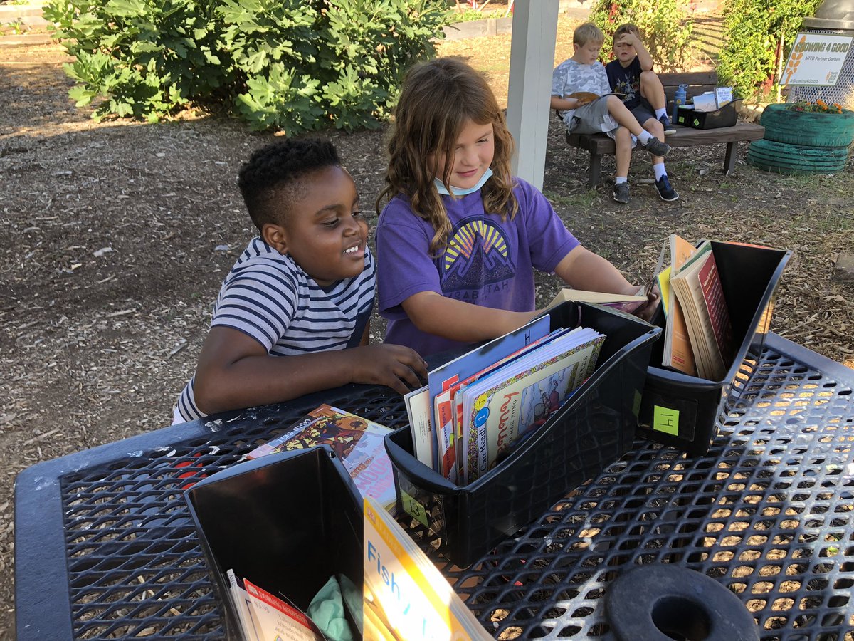 Beautiful weather = reading with our buddies at the MHE farm! #risdpoweroflove