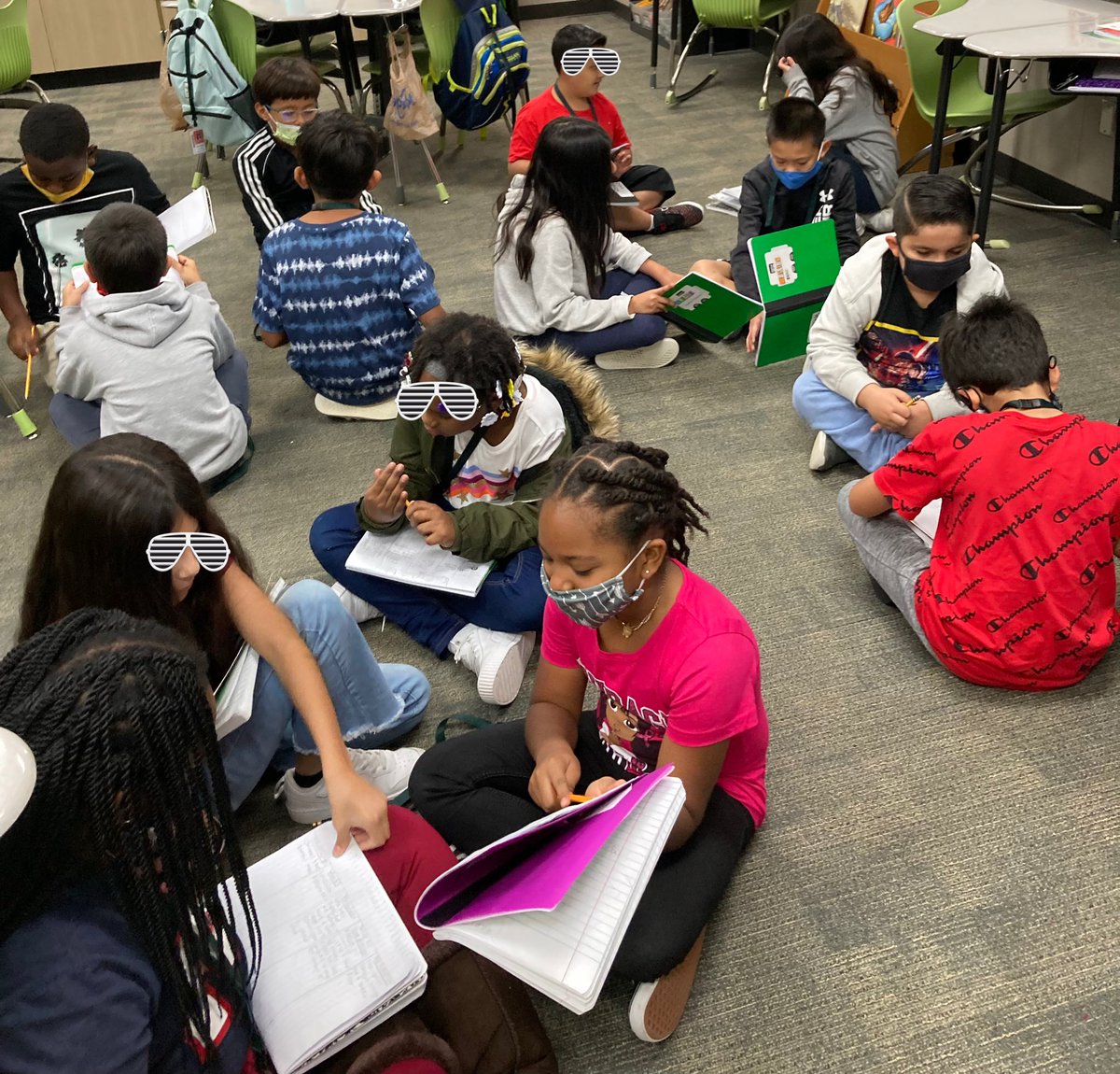 Writers discuss their story ideas with partners.