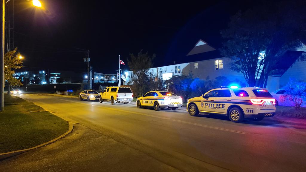Noble41's tweet photo. A large police presence at the Royal Canadian Legion on The Boulevard right now. One person was found nearby and has been taken into custody with the assistance of Cst Kennedy and PSD Gunner. #nltraffic @NTVNewsNL https://t.co/u7qpm7dqaD