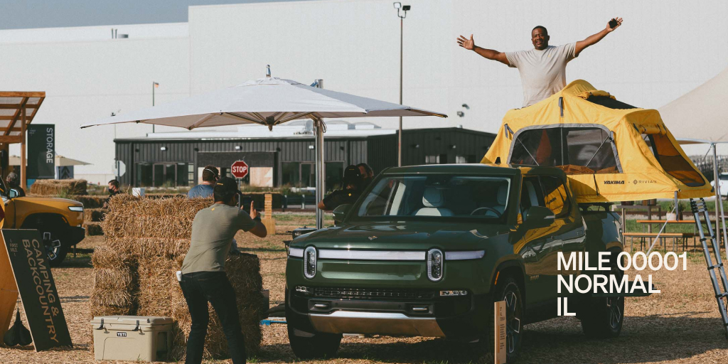 Rivian's tweet photo. Thank you to everyone who came out to #FirstMile in Normal! We’ve loved getting to see your reactions, answer your questions, and let you get behind the wheel. There’s no substitute for seeing an R1T in person, and we can’t wait to meet more of you! https://t.co/RGVb27rWSQ